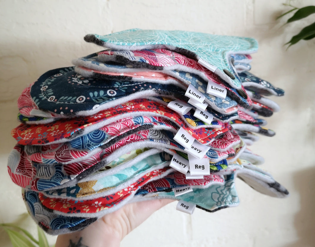 Stack of multiple sizes cloth sanitary pads
