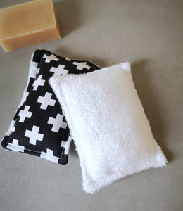 Bamboo towelling reusable sponge in a black design with white crosses.